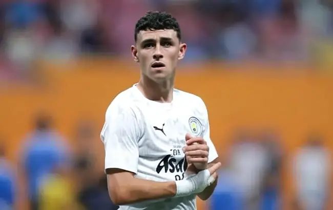 Jack Grealish and Phil Foden at the British Grand Prix at Silverstone
