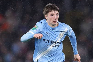 Charlie Gray in Manchester City training kit, looking focused during a session at the academy training ground.