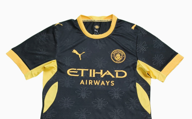 Leaked image of Manchester City's 2026/27 away kit featuring a black shirt with embossed worker bee pattern